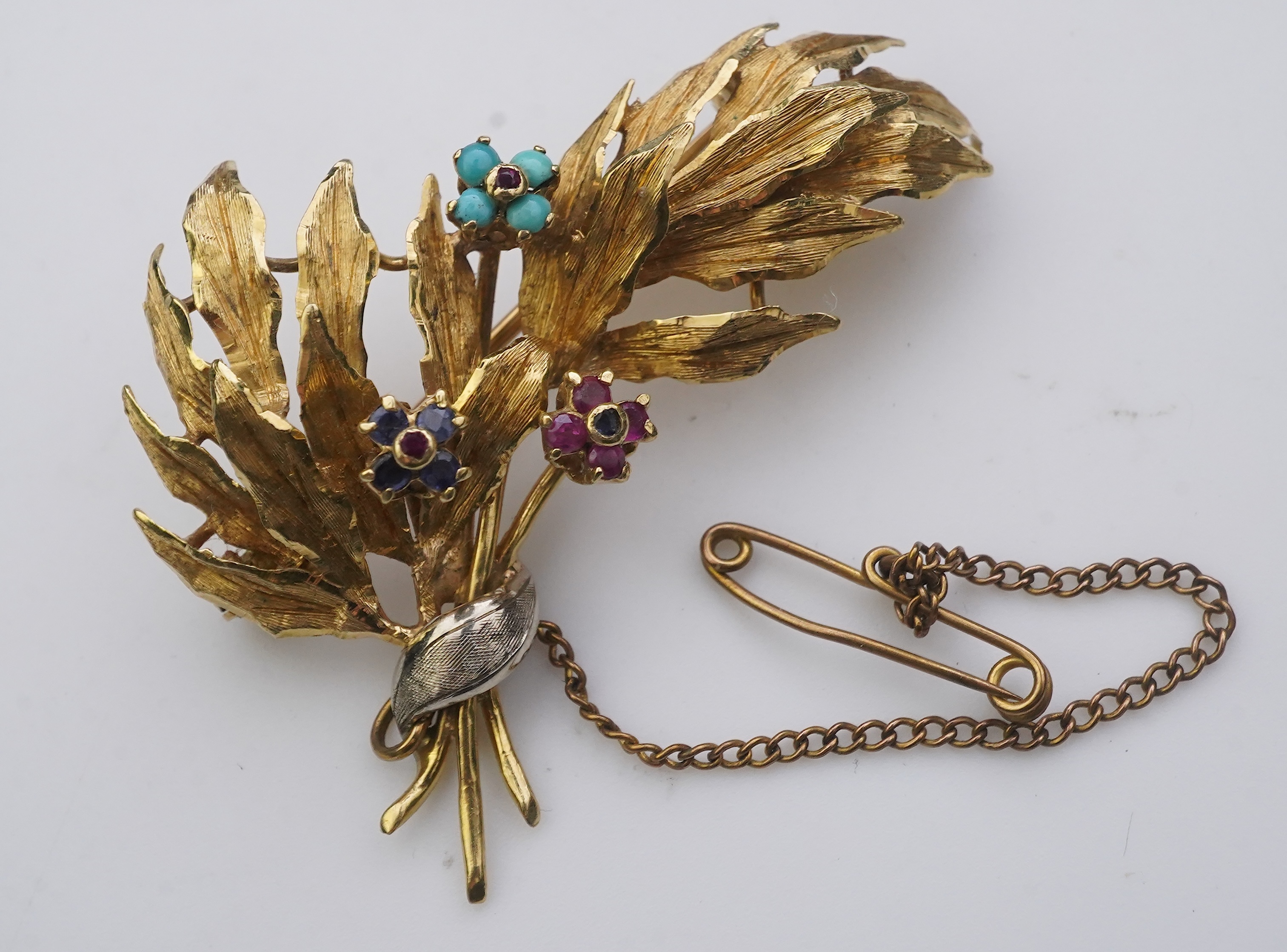 A collection of three brooches and a pendant, 19th and 20th century